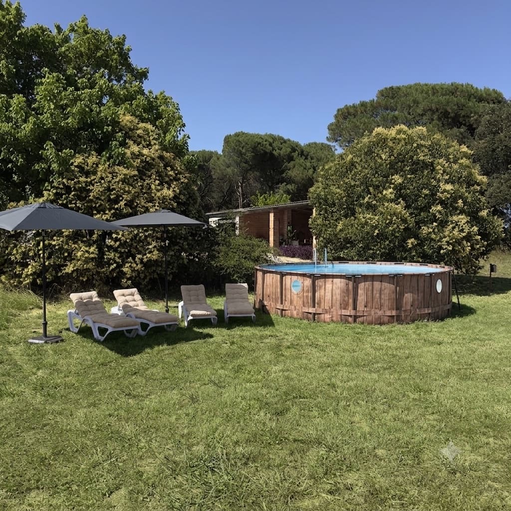 Private above-ground pool with loungers at Can Sureda